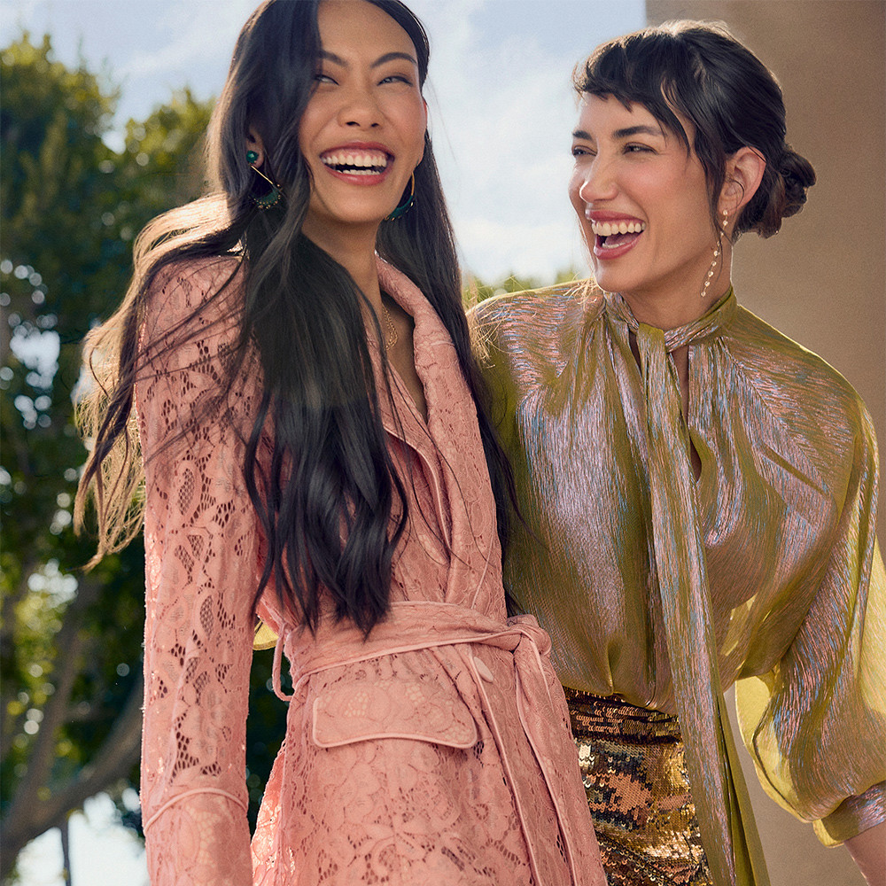 Two women posing and smiling