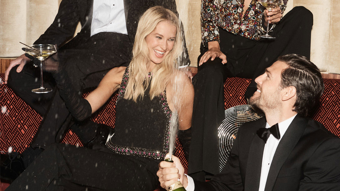 Man and women enjoying champagne